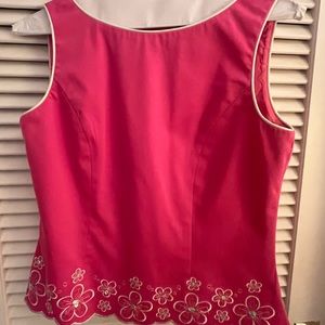 Cute hot pink, back zip top with white embroidery.